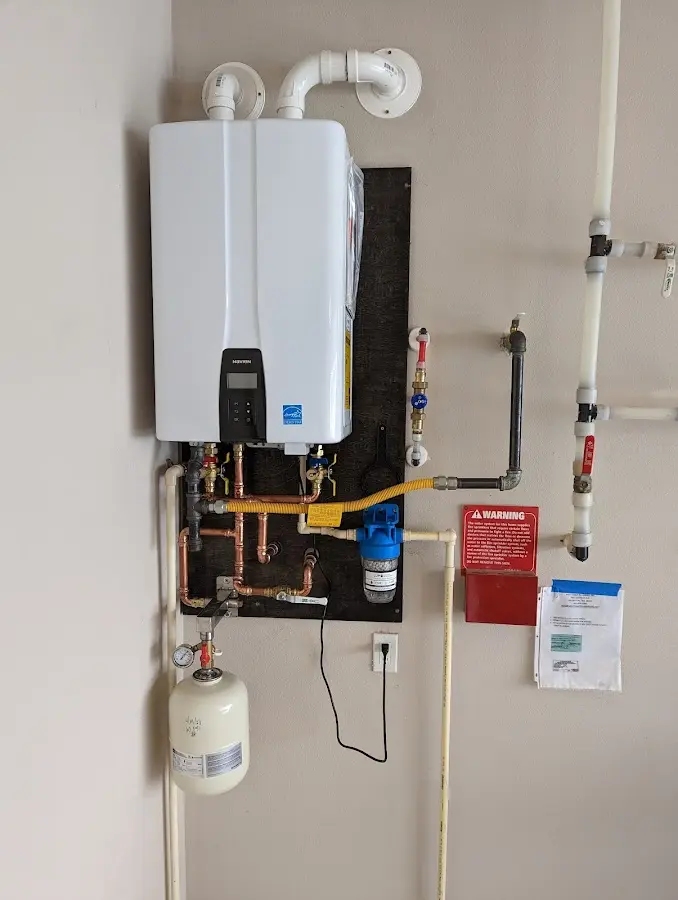 Professional plumber installing copper piping in a Gibraltar home